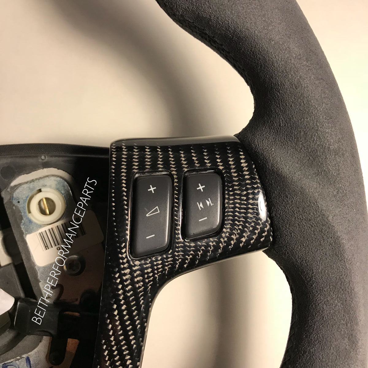 2004-2007 Cadillac CTS-V – Carbon – Black Stitching, Red Stripe